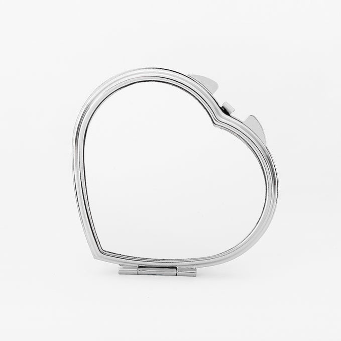 A silver heart-shaped compact pocket mirror with a clasp closure, displayed against a white background.