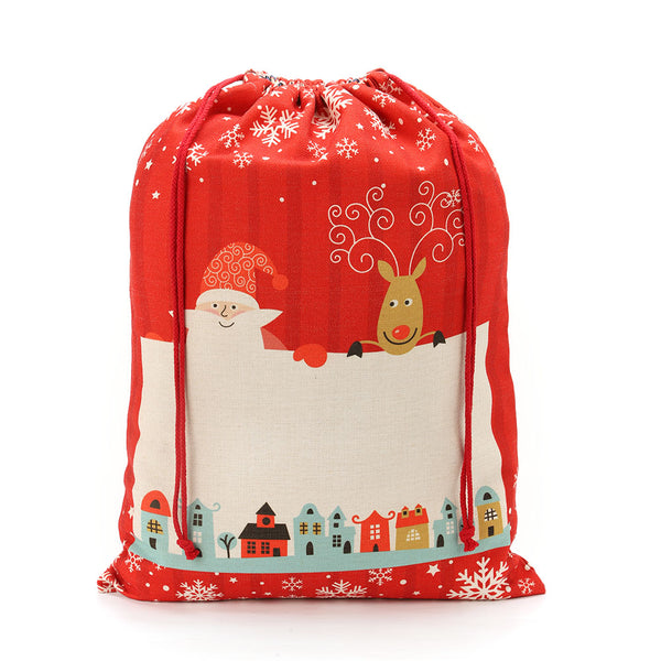 Red linen Christmas drawstring sack with Santa, reindeer, snowflakes, and festive village print