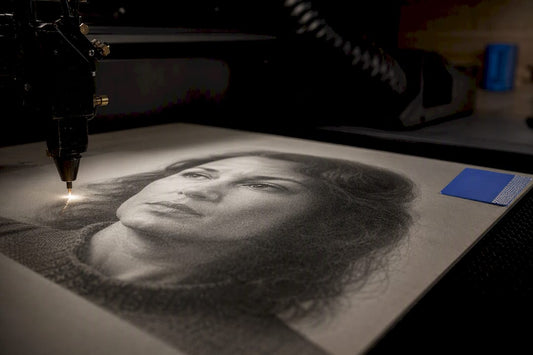 Portrait being raster engraved in workshop